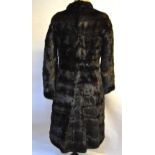 A dark brown mink fur coat,