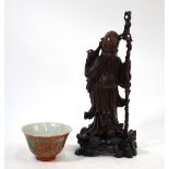 A Chinese wood sculpture of Shoulao, holding a gnarled staff, 23cm high,