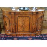A Victorian inlaid burr walnut credenza with bow end arched panelled cupboards flanking a panelled