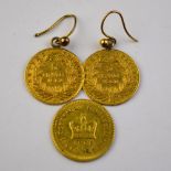 A pair of earrings formed from two gold coins,