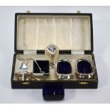 A silver three-piece condiment set with blue glass liners, Deakin & Francis,