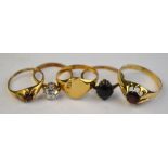 Group of rings including two garnet set 9ct rings, one CZ single stone ring, 9ct set,
