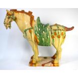 A sancai decorated, Chinese horse, looking to the left, after a Tang Dynasty original,