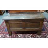 An 18th century oak jointed oak coffer with Celtic motif carved frieze, on stile legs,