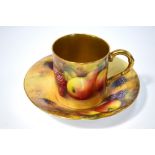 A Royal Worcester coffee can and saucer painted with fruit, the saucer signed H.