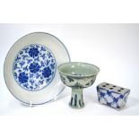 Three pieces of blue and white ceramics, comprising: a stem cup with circular bowl,