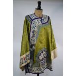 A Chinese green textile gown with white ground sleeves, collar and fringe,