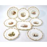 An English 19th century porcelain dessert service having moulded gilded borders and centres