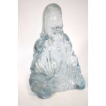A Chinese translucent glass or crystal figure of Guanyin,