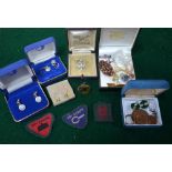 A small collection of jewellery including mauve paste brooch and earrings,