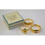 Three 18ct yellow gold rings, each set with a single diamond,
