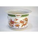 A Chinese famille rose planter, decorated with floral designs and designed with a hole at the base,