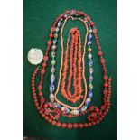 A collection of vintage bead necklaces including two rows of antique stick coral,