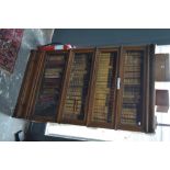 An oak Globe Wernicke four section bookcase over a plinth drawer