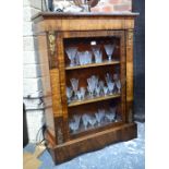 A Victorian gilt metal mounted inlaid mahogany pier cabinet with glazed panel door raised on a