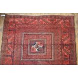 A worn Afghan rug,