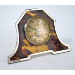 An Art Deco style silver and tortoiseshell-mounted strut-clock with silvered dial, Atkin Bros.