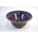 A mottled lavender/purple glazed, Chinese monochrome bowl on circular foot, 16 cm diameter,