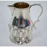 A late Victorian small silver baluster cream jug in the Georgian manner,