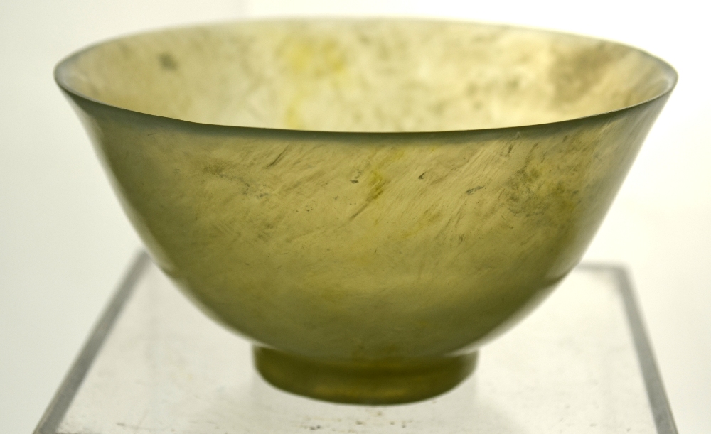 Two Chinese, semi-translucent mottled-green stone bowls; each one on a circular foot. - Image 9 of 10