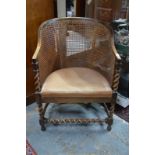 A caned dark walnut framed chair circa 1920s