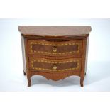 A late 19th century miniature model of a serpentine commode chest of two long drawers,