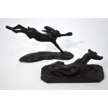 A black patinated bronze leaping hare, 14 x 20 cm signed with monogram (not identified),