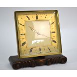 A Garrards Art Deco style mantle clock with square gilt bezel and chapter ring,