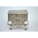 A late Victorian silver novelty pill-box in the form of a rococo table,