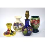 Four Moorcroft items, comprising: an ovoid vase with domed foot,