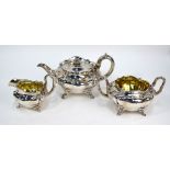 A William IV silver three-piece tea service of lobed and compressed form,