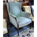 A late 19th century Sheraton Revival wing armchair,