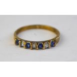 A pale sapphire and diamond half eternity ring