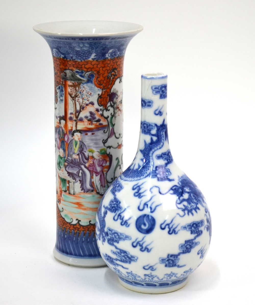 A Chinese famille rose vase with trumpet neck and underglaze blue design,