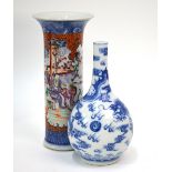 A Chinese famille rose vase with trumpet neck and underglaze blue design,