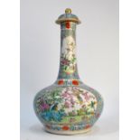 A Chinese famille rose bottle vase and domed cover with knop finial;