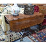 A Victorian mahogany drop leaf crossbanded mahogany table with frieze drawer to one end,