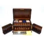 A Victorian burr walnut games compendium with Staunton pattern chess men,