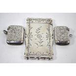 A silver cartouche-shape visiting card case with engraved decoration, inscribed 'Simone Pye', G.C.