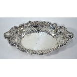 A late Victorian silver elliptical pierced bowl with foliate scroll rim, Nathan & Hayes,