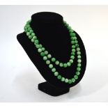 A mottled green necklace with 88 beads,