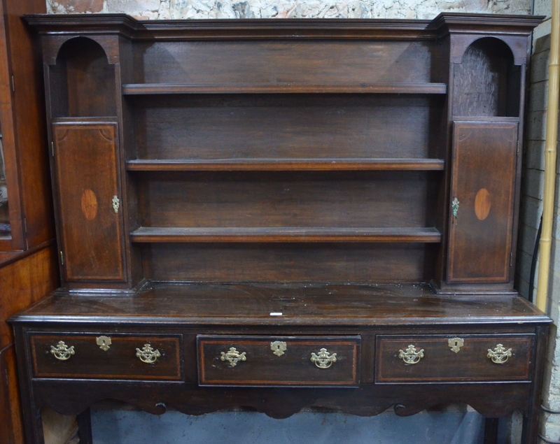 An 18th century style crossbanded oak high dresser,