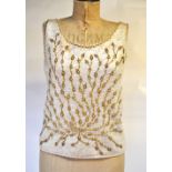 A 1950s hand-beaded and sequinned evening top lined with ivory silk, 47 cm across chest,