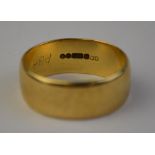 A 9ct yellow gold wide wedding band,