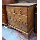 A small 18th century oak/elm chest of two short over two short drawers,