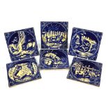 Minton Hollins & Co - a set of six blue glazed tiles depicting fables of Jean de La Fontaine,