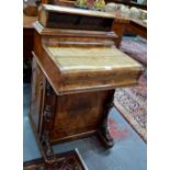 A Victorian inlaid burr walnut piano top Davenport desk with tooled leather adjustable slide over