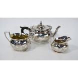 A Victorian silver oval half-reeded bachelor tea service, Elkington & Co., London 1861, 22.