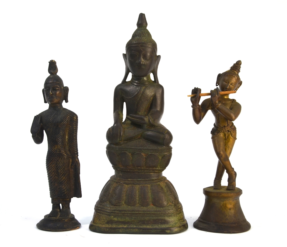 Three Asian metal sculpture, comprising: a standing figure of Krishna, playing the Divine Flute,