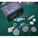 A collection of vintage jewellery including Art Deco dress buckle, top hat and cane brooch,